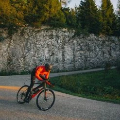 PEdALED Tokaido Alpha Jacket - Coral Red -Cycling Accessories Shop men alpha cycling jacket coral red tokaido pedaled action front