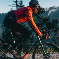 PEdALED Tokaido Alpha Jacket - Coral Red -Cycling Accessories Shop men alpha cycling jacket coral red tokaido pedaled action side